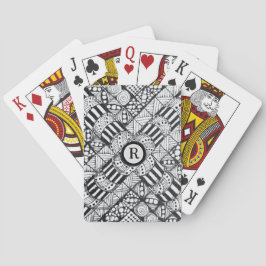 Handritad klotter i svart och vitt med monogram casinokort