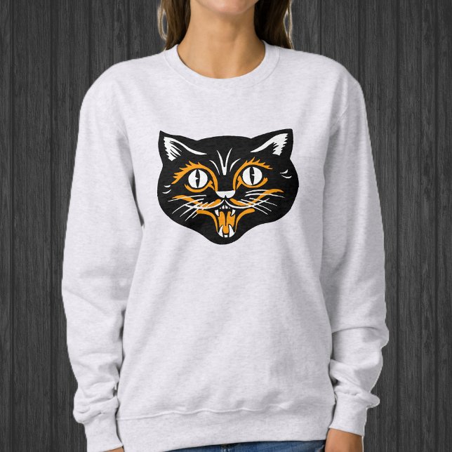 Happy halloween svart katt Ansikte med Orange vit T Shirt (Happy Black cat face for Halloween with orange and white accents on sweatshirt.)