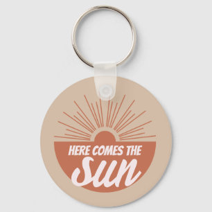 Här kommer sol nyckelring
