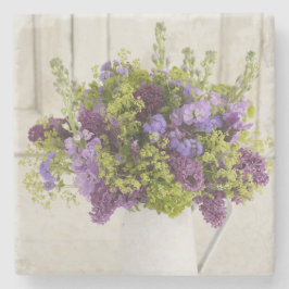 Härlig lila- och gröntblommigtbukett underlägg sten