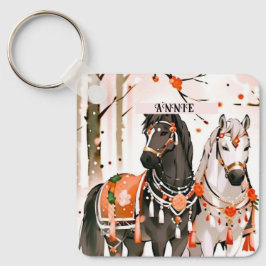 Hästar i ett eget namn på en röd skog nyckelring