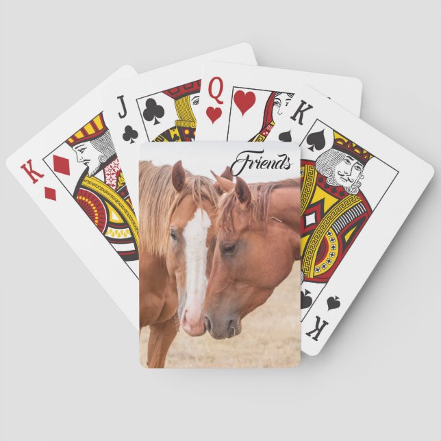 Hästar nosar i en betesmark  casinokort (Baksidan)