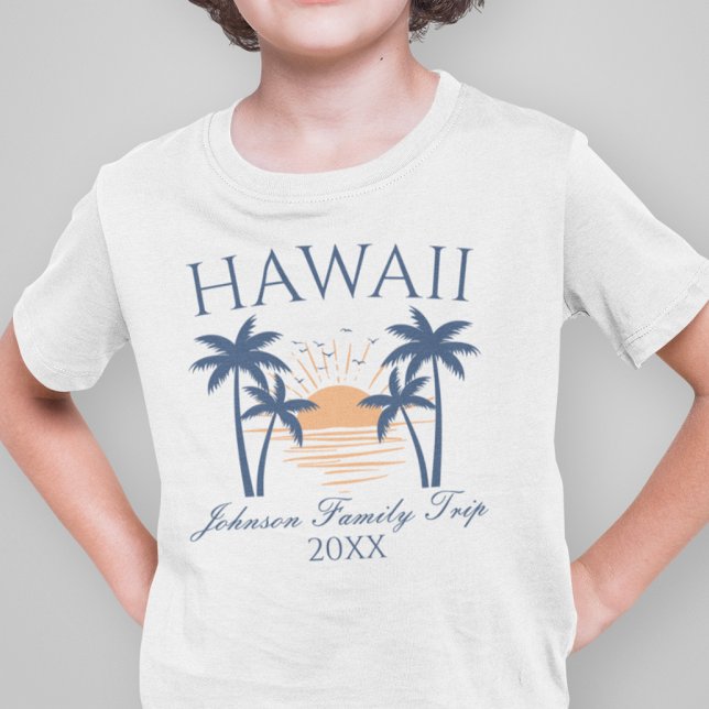 Hawaii Family Vacation Resa T-Shirt (Boy wearing a Hawaii family trip t-shirt with a sunset and palm tree design.)