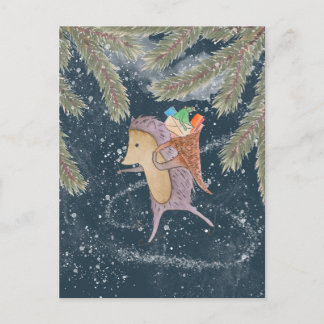 Hedgehog på skis. Basket med gåva på axeln Vykort