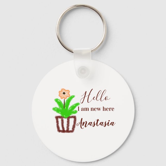 Hej jag är ny här, babyduschbarn blommigt löv p nyckelring (Framsida)