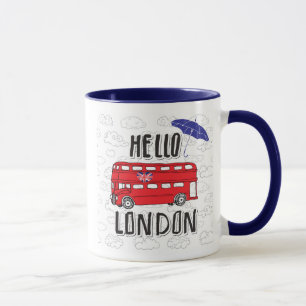 Hejer London räcker märkt undertecknar med Mugg