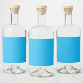 Heldig klarblå bakgrund med en subtil struktur spritflaskor etikett