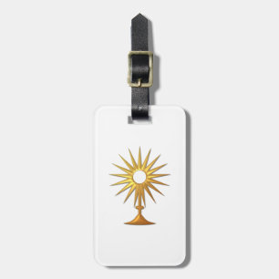 Heliga Eucharist i guldmonstrance Bagagebricka