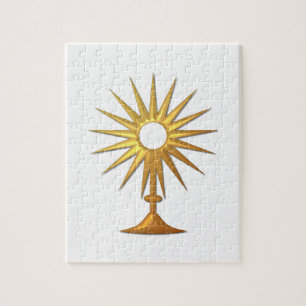 Heliga Eucharist i guldmonstrance Pussel