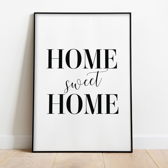 Hemsöt hemtypografi Poster Skriv ut (Home Sweet Home Poster Print in a black frame on the floor.)