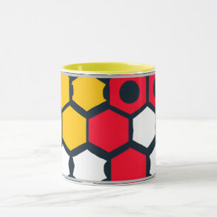 Hexagoner av rött och gult Mugg