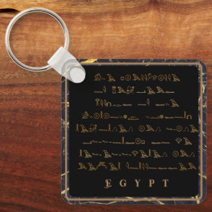 Hieroglyfer Egypten svart och guld ram Nyckelring