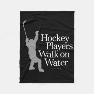 Hockeyspelare går på vatten fleecefilt