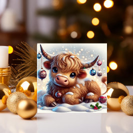 Höglandska kor som vilar i snöig julvärld julkort