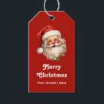 Holly Jolly Jultomten Retro jul Presentetikett<br><div class="desc">Ge märkre med en glatt illustration av en vintage stil Jultomten med röda rosyskskinn och bär hans klassiska rödtomhatt och stora vita björn. En snårskog bidrar till den festliga helgdag i denna utformning.</div>
