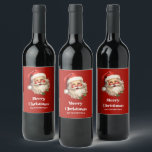 Holly Jolly Jultomten Retro jul Vinflaska Etikett<br><div class="desc">Flaska-etiketter med en glatt illustration av en vintage stil Jultomten med röda rosyskon. Hans klassiska röda julhatt och hans stora vita skägg. En snårskog bidrar till den festliga helgdag i denna utformning..</div>