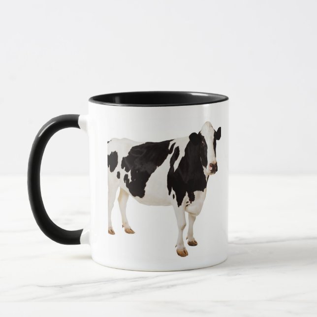 Holstein ko (Bostaurusen) Mugg (Vänster)