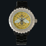 Honeybee Honeycomb Fransk Bee Bumblebee Anpassning Armbandsur<br><div class="desc">Denna vackra biskopsklocka visar ett söt bin över en ljus bikamera. Gult och svart bin har mer vit vingar. Bakgrunden är en söt guldbikupa mönster. Bin kommer levande och verkar nå höger ut ur designen, och dess vingar sprids över det romerska numeriska gräns. I utformningen ingår också ett litet krona...</div>