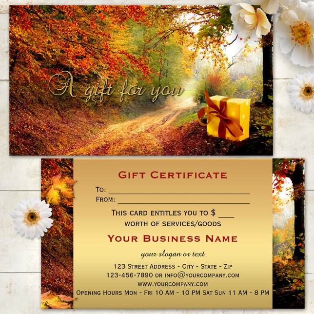Höstskogs Guldpresentkort Visitkort (A beautiful fall gift certificate featuring an image of a package in the forest - with gold)