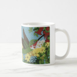 Hummingbird reproducerad från en räckabroderi kaffemugg
