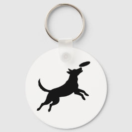 hund hoppar för att fånga en frisbee nyckelring