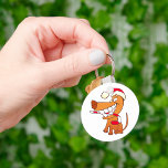 Hund i en Santa Hat Keychain Nyckelring<br><div class="desc">Den här designen är en hund i en jultomte. Hund har en stor flin vid ansikte när den bär julhatten. Den här hund i en stolthattdesign ser underbar ut på den här nyckelkedjan</div>