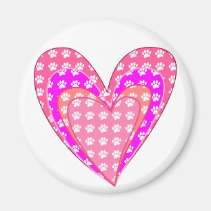 Hundfötteravtryck och rosa hjärtan magnet