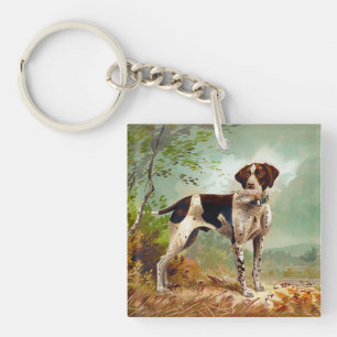 Hunter hund med fågel i munnen
