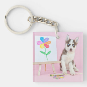 Husky Puppy Måla en regnbågsblomma