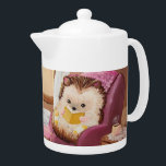 Hygge Hedgehog<br><div class="desc">En mysigt hedgehog skriver i en komfyllig stol med en bok i denna akryliska illustration av Lydia Holloway.</div>