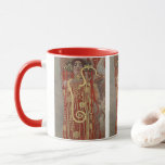 Hygieia av Gustav Klimt, Vintage Art nouveau Mugg<br><div class="desc">Hygieia (c. 1901) av Gustav Klimt är en vintage av Viktorian Era Symbolism-målning med den grekiska gudinnan av hygien, hälsa, renlighet och sanitet tillsammans med den asculapiska ormen runt hennes arm och kopp av Lethe i hennes hand. Hygieia är en del av en av tre målningar som kallades "Faculty Paintings"...</div>