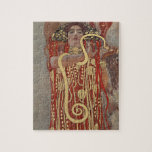 Hygieia av Gustav Klimt, Vintage Art nouveau Pussel<br><div class="desc">Hygieia (c. 1901) av Gustav Klimt är en vintage av Viktorian Era Symbolism-målning med den grekiska gudinnan av hygien, hälsa, renlighet och sanitet tillsammans med den asculapiska ormen runt hennes arm och kopp av Lethe i hennes hand. Hygieia är en del av en av tre målningar som kallades "Faculty Paintings"...</div>