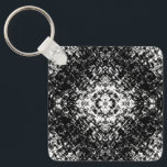 Hypnotic Abstract Black And White Modern Art Nyckelring<br><div class="desc">Keychain key ring and key fob holder printed with Hypnotic Abstract Black And White Modern Art digital graphic Illustration contemporary design drawing by TheFabricSeal print on demand shop at Zazzle.com #ZazzleMade ©️Original. https://www.zazzle.com/store/thefabricseal This is a great design for enthusiasts of artistic modernism with two bold popular colors black and white...</div>