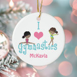I Kärlek Gymnastics Cute African American Girl Julgransprydnad Keramik<br><div class="desc">Den söta julklappen i Kärlek Gymnastics har en liten svart flicka och ett historiskt barn som tumlar på brev. En vacker teckning av en afrikansk amerikansk gymnast.</div>