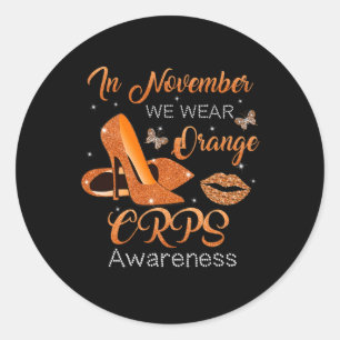 I november Bäror vi Högklackar för Orange av CRPS Runt Klistermärke