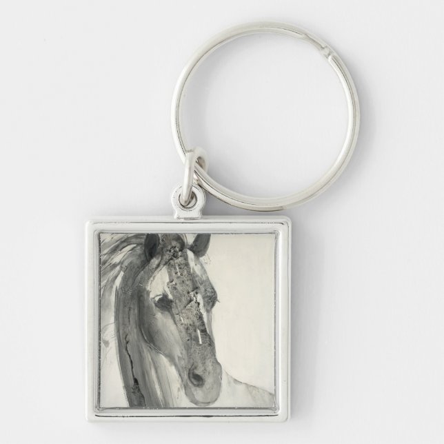 I vinden mig fyrkantig silverfärgad nyckelring (Framsidan)