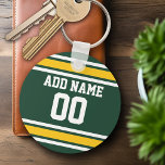 Idrottsteamets fotbollsnummer Jersey-nummer Nyckelring<br><div class="desc">Mörk grönt och Golden Gult färg - Om du äger ett fantasyskt fotbollslag,  gör dina egna produkter och visa upp för dina vänner! Eller - spelar du High School Football och vill ha ett PM? Den här idiotiska designen är perfekt för alla som leker sport.</div>