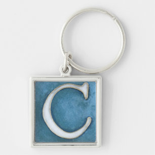 initial c-keychain, vit och skuggar av blått fyrkantig silverfärgad nyckelring