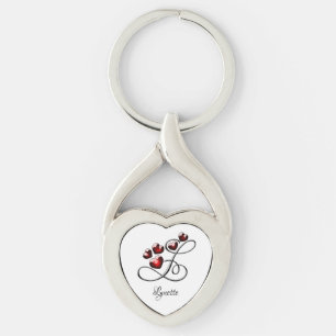 Initial och hörn twisted heart silverfärgad nyckelring