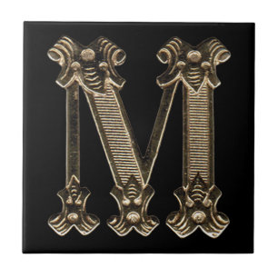 Initialt guld- brev M eller Monogram på svart Kakelplatta