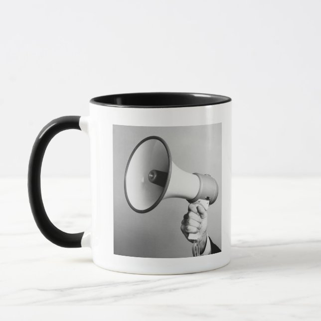 Innehav räcker mugg (Vänster)
