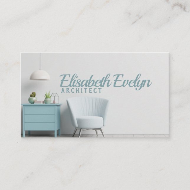 Insida har en armstol på den tomma vita väggen visitkort (Framsida)