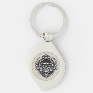 Intrikat skalle-design med vingar och symboler swirl silverfärgad nyckelring