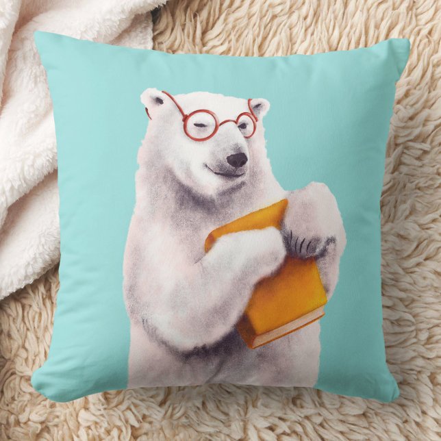 Isbjörn Läsande Konst – Bokälskare Kudde (blue pillow with a polar bear with eyeglasses holding a yellow book)
