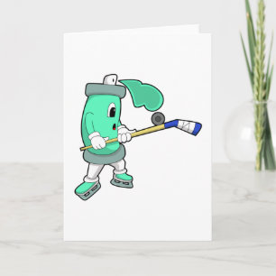 Isspray vid ishockey med ishockeyklubba kort