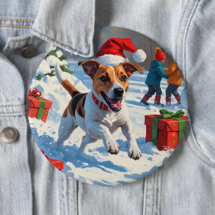 Jack Russell springer i snö med julhatt Knapp