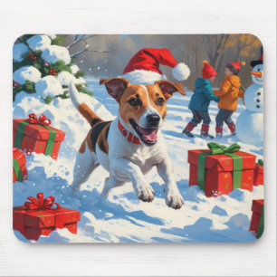 Jack Russell springer i snö med julhatt Musmatta