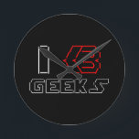 JAG Heart Geeks ASCII ART Rund Klocka<br><div class="desc">Lustigt Geeky I Heart Geeks ASCII TEXT ART. Globe Trotters specialiserar sig på idiosynkratiskt bildmaterial från hela världen. Här hittar du unika hälsningskort,  vykort,  Poster,  Mousepads med mera.</div>