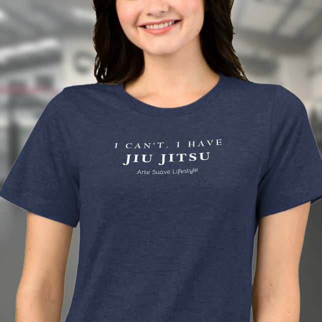 Jag kan inte ha Jiu Jitsu Arte Suave Womans T Shirt (Navy blue BJJ Tshirt on female model on a gym.)