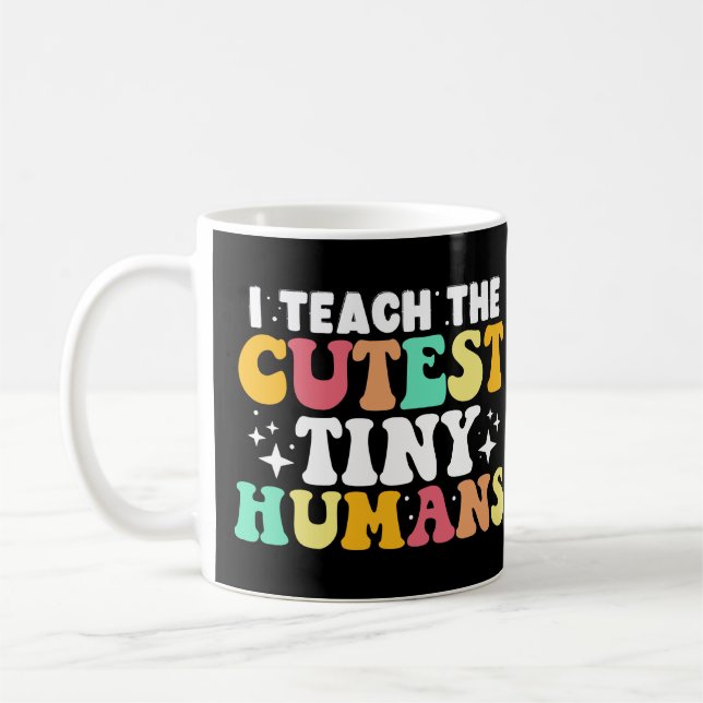 Jag lär mig den finaste Tiny Humans Funny Teacher Kaffemugg (Vänster)